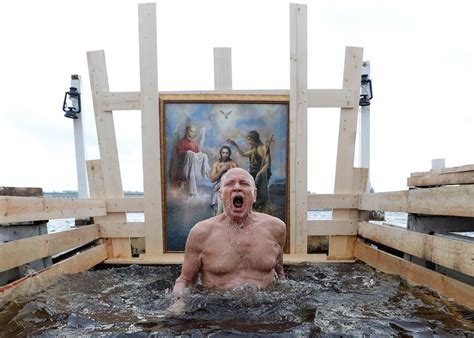 Orthodox Russians indulged on Friday in the annual Epiphany tradition of diving into blessed water, only this year instead of digging a hole into the ice as normally during Russia&x27;s severe winter, bathers shivered in rainy weather as temperatures hit a seasonal record high. . Orthodox epiphany bathing